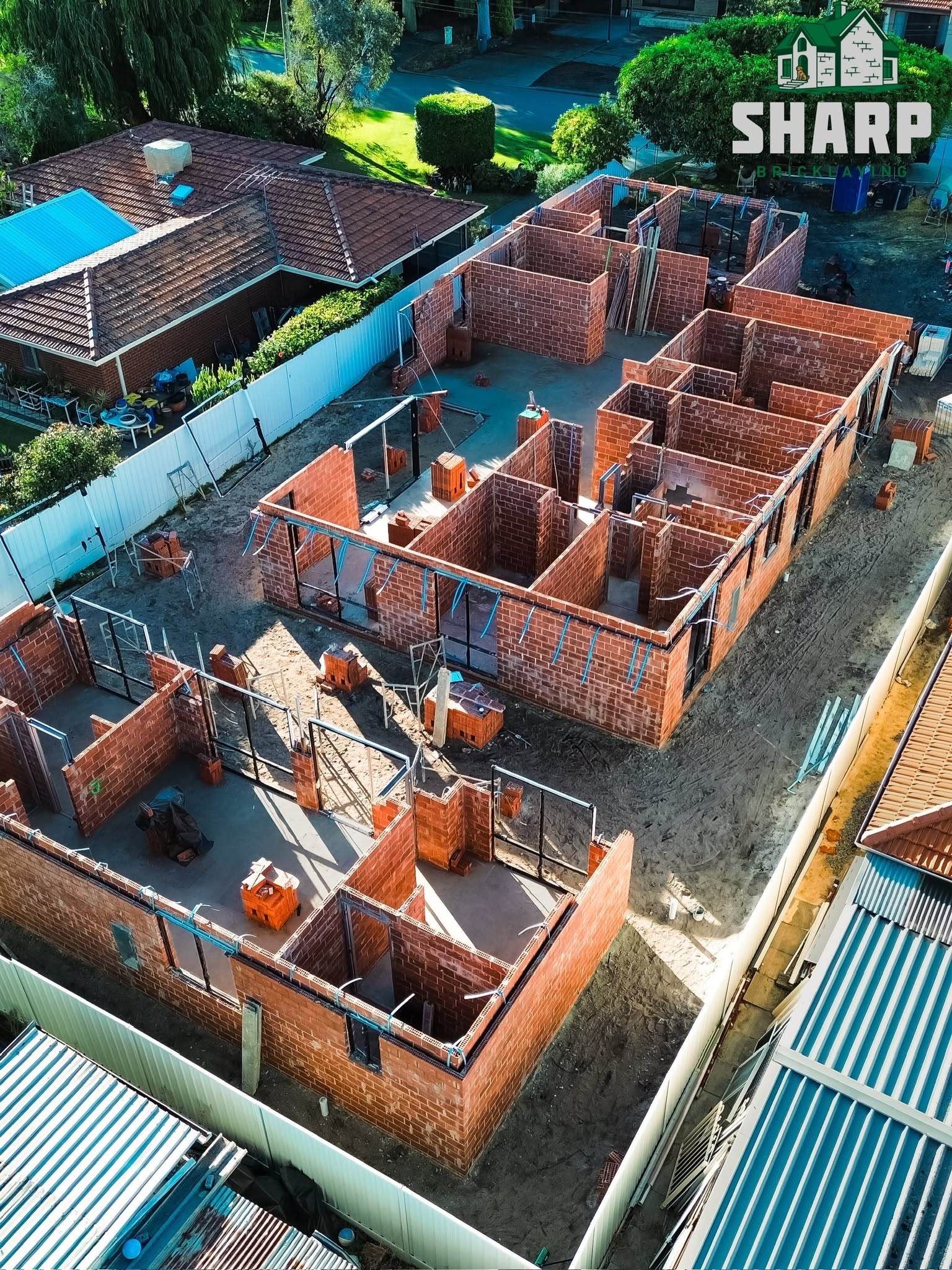 Aerial view of brick walls on a two storey residential build